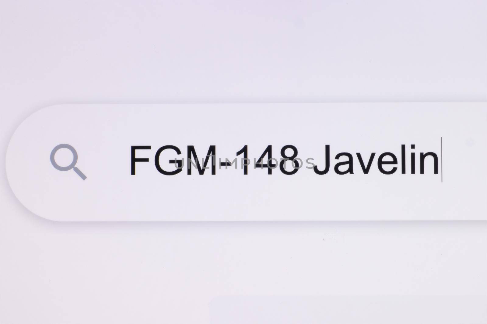 fgm148 Javelin - Internet browser search bar typing destination text. Typing the word Javelin in the browser on a pixelated computer screen