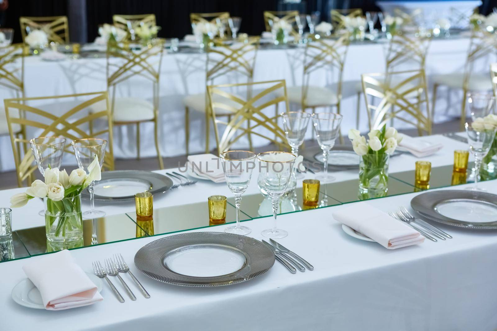 Beautifully organized event. Served festive table ready for guests. Shallow doff