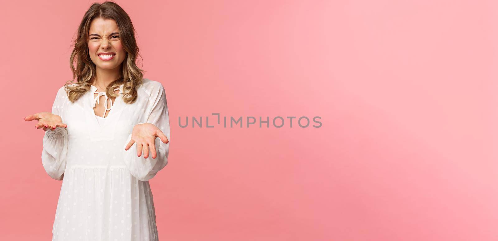 Portrait of dissatisfied, disappointed cute girl in white dress, cringe show tongue, smell something awful, pointing with raised hands at bad unappropriate thing, grimacing dislike, pink background by Benzoix