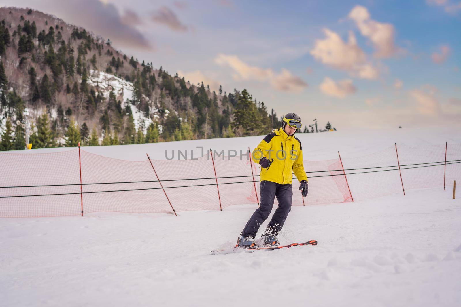 Ski instructor at training track showing students how to ski by galitskaya