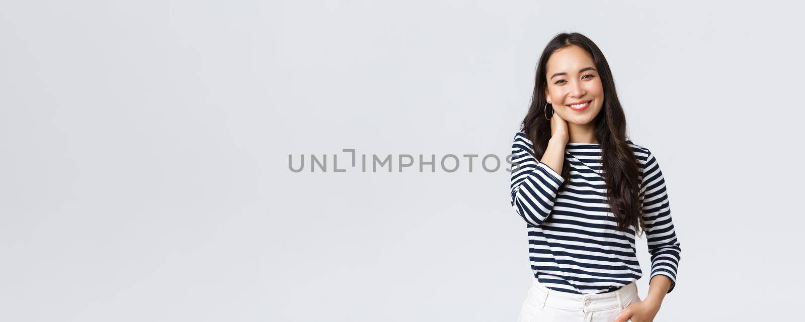 Lifestyle, people emotions and casual concept. Joyful beautiful asian woman in stylish casual clothes, touch neck blushing and smiling, having small talk at romantic date by Benzoix
