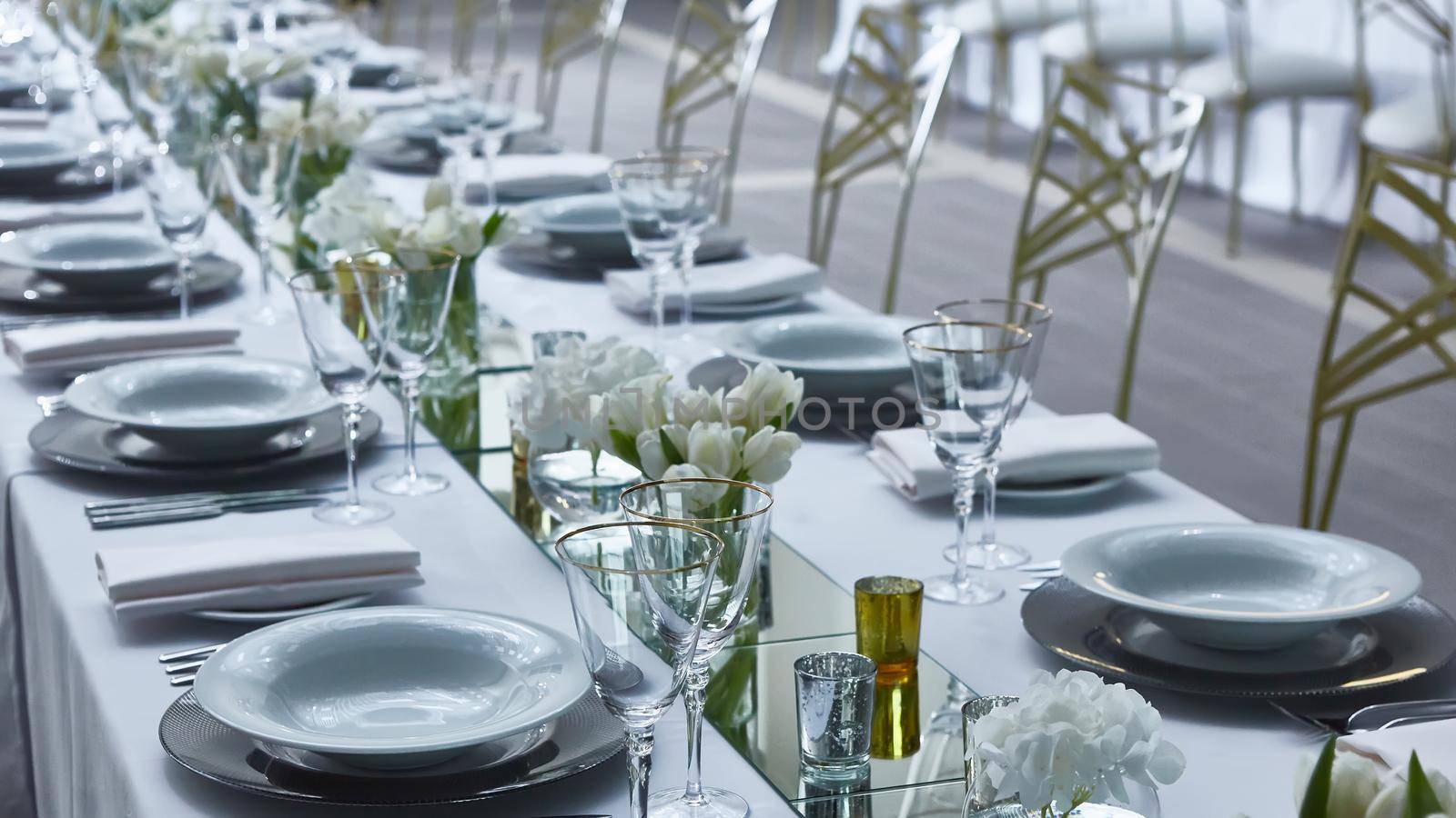 Beautifully organized event. Served festive table ready for guests. Shallow doff