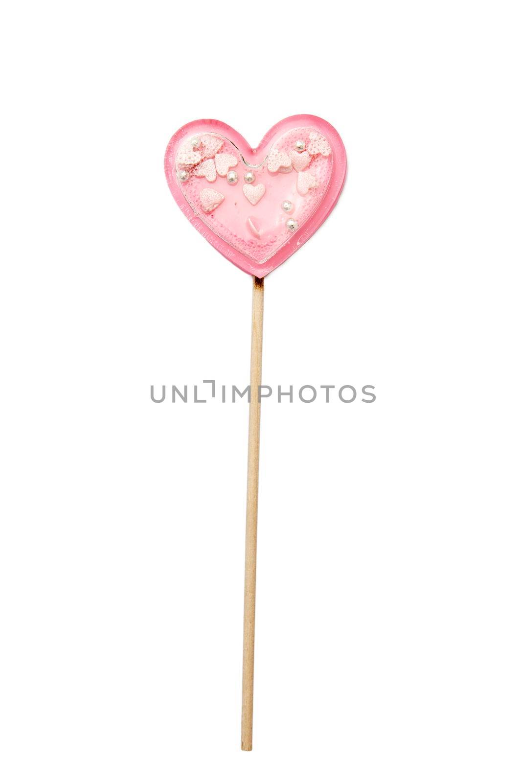 Pink star lollipop inside on a stick isolated on white. Gift for Valentine's Day. square format by elenarostunova