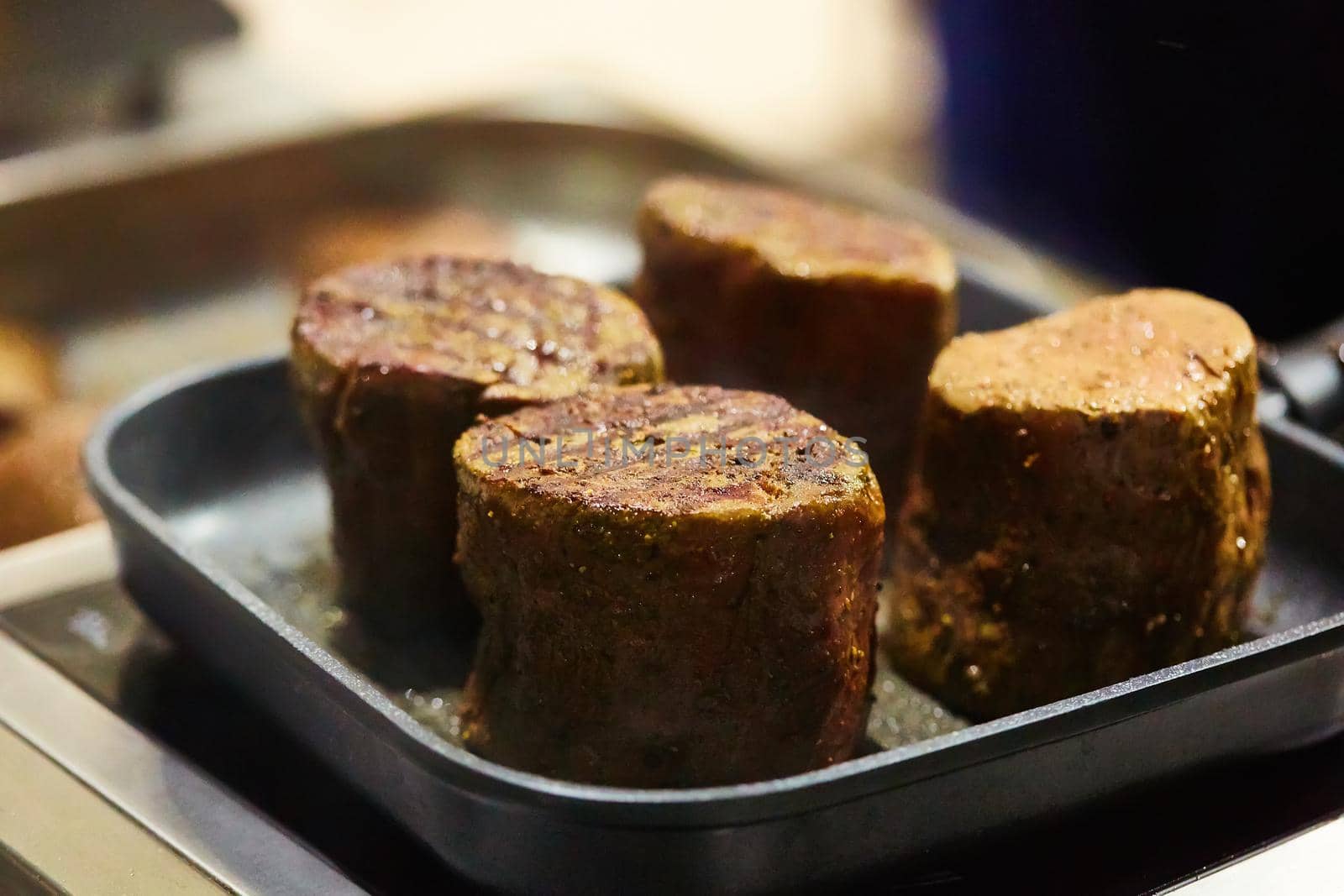 The beef steak in a frying pan. Shallow dof.