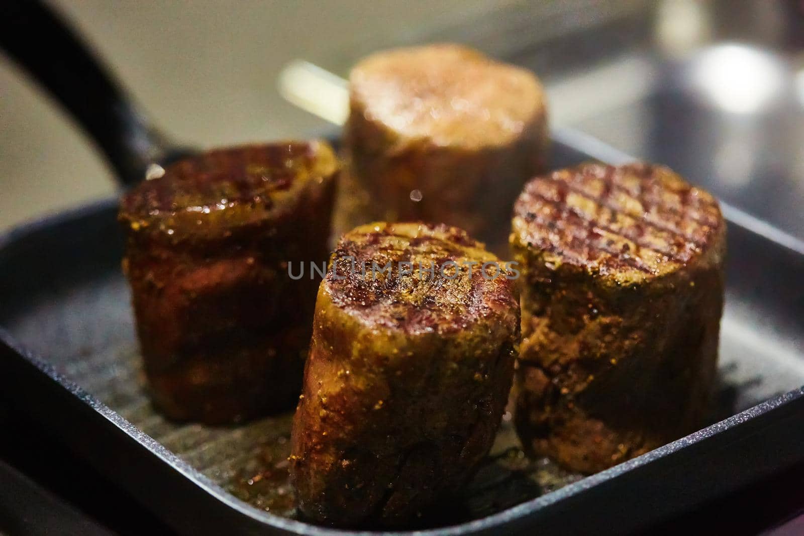 The beef steak in a frying pan. Shallow dof.