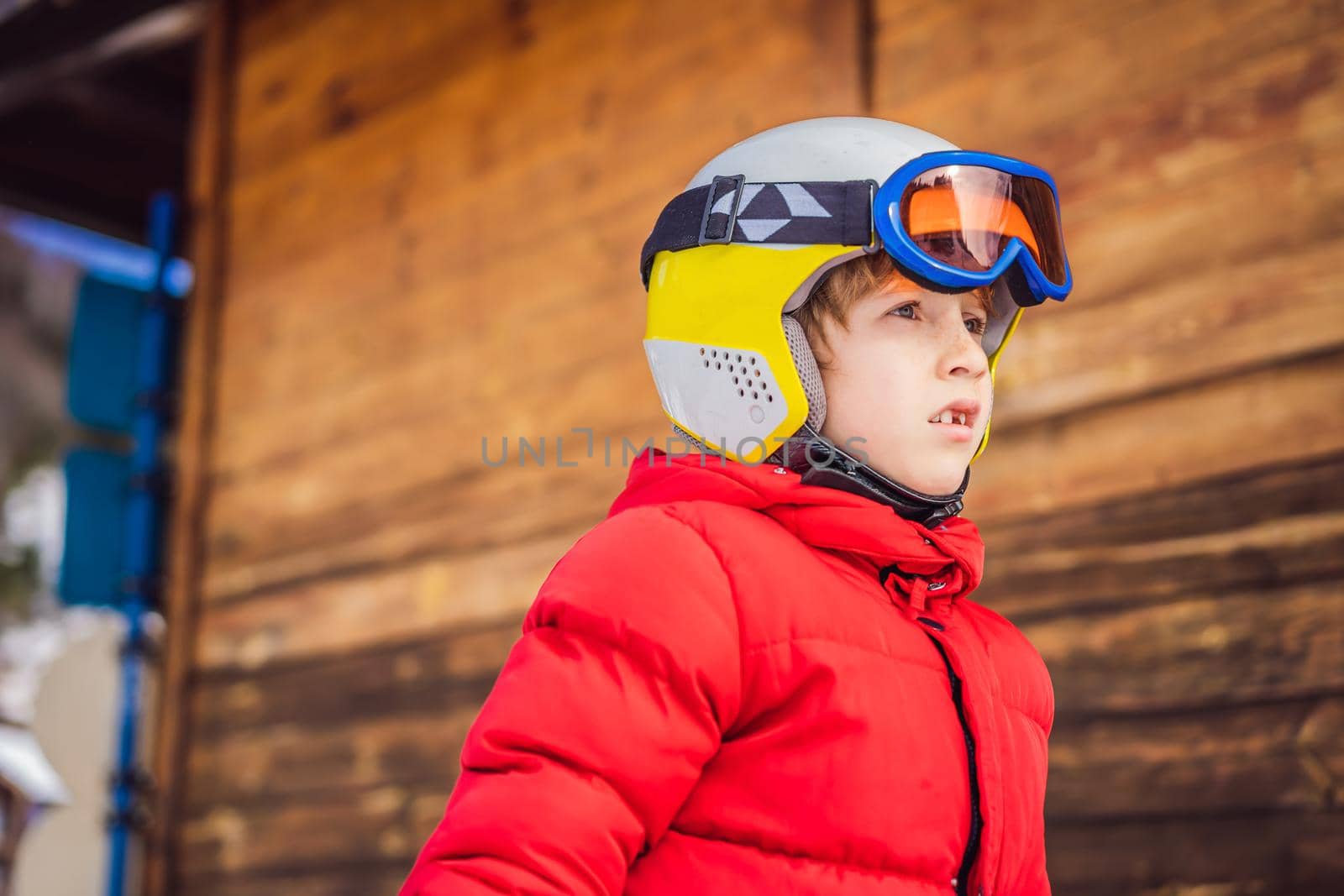 Child skiing in mountains. Active toddler kid with safety helmet, goggles and poles. Ski race for young children. Winter sport for family. Kids ski lesson in alpine school. Little skier racing in snow by galitskaya