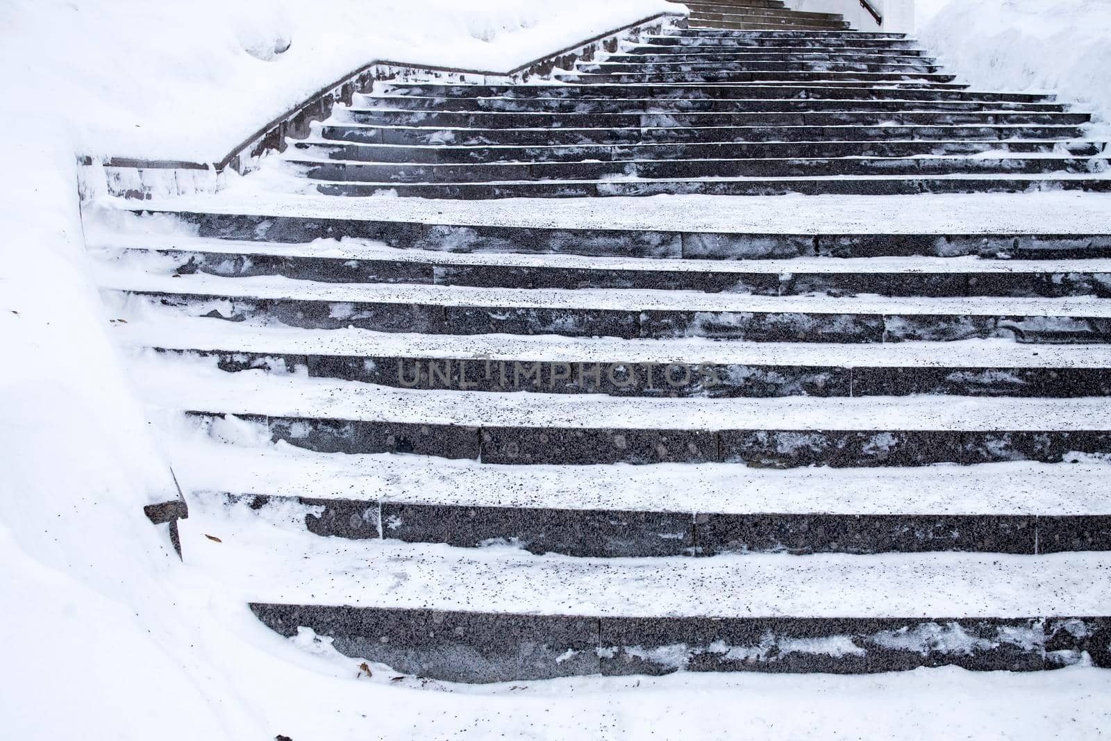 Snow-covered steps leading up to the building