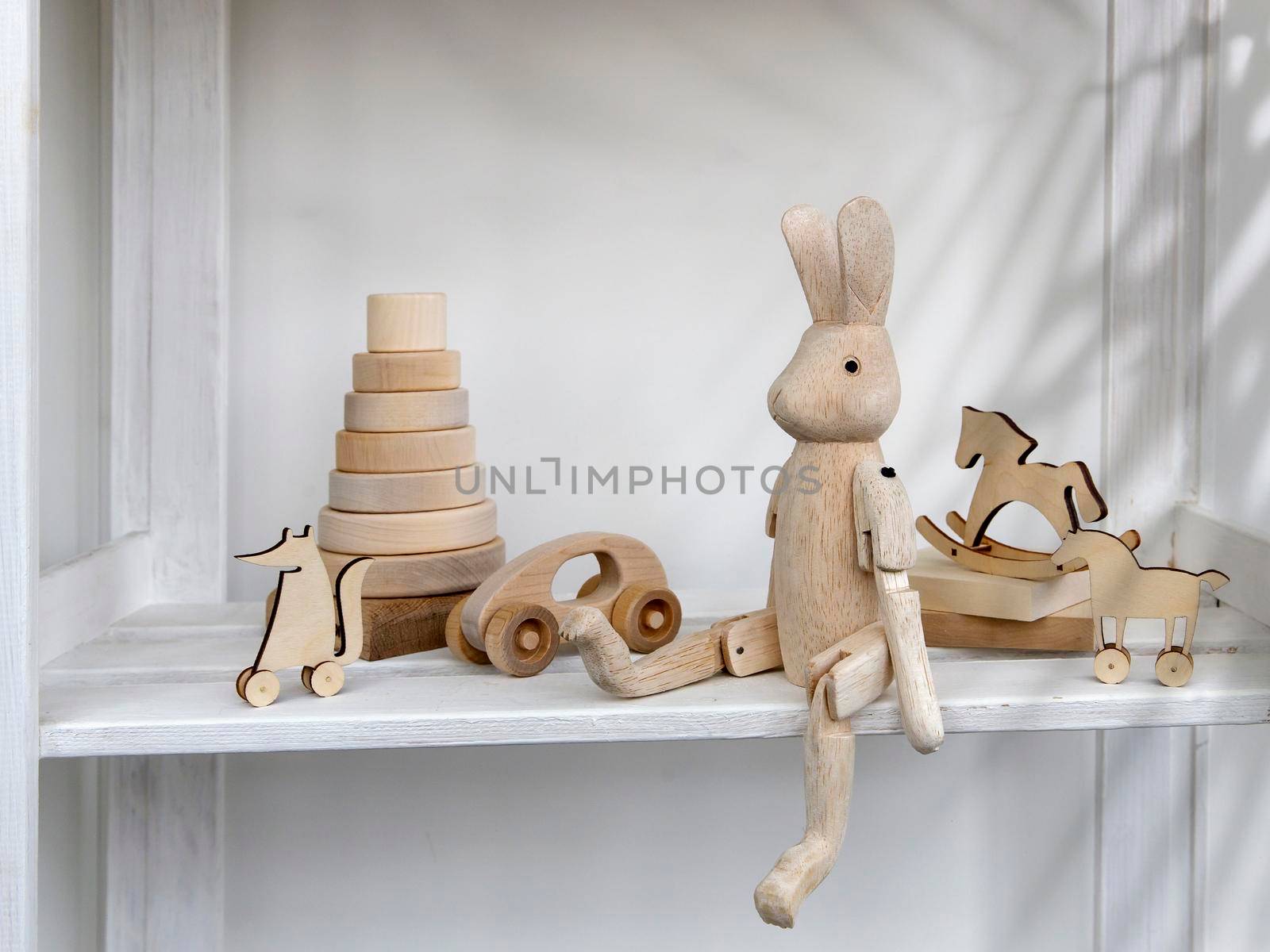 Wooden toys made of natural wood, eco-friendly are in the children's room for learning and playing. Space for text. Copy space by elenarostunova