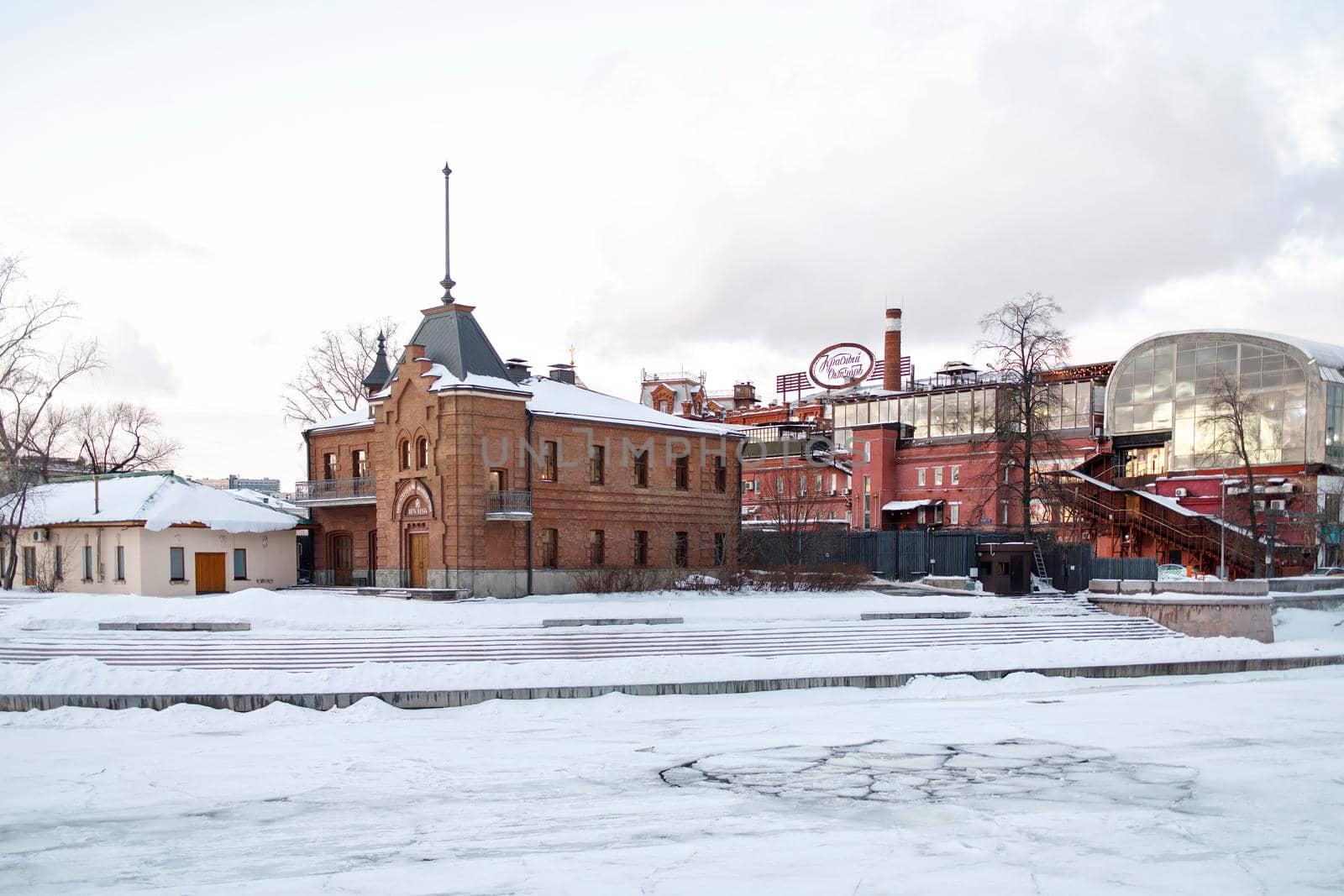 Moscow, Russia - 16.01.2022, Crimean embankment. View of Red October. Winter. Ice on the river