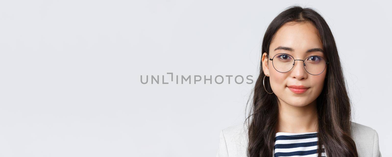 Business, finance and employment, female successful entrepreneurs concept. Close-up of modern stylish asian businesswoman in glasses looking confident and determined at camera.