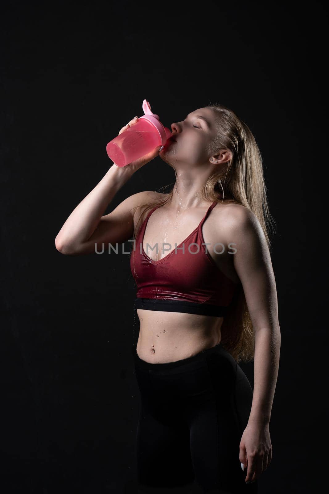 In holds shaker fitness sex hand pink a her girl in black background shaker pink black workout, from gym lifestyle for healthy for trainer isolated, sexy people. Sweat model beauty