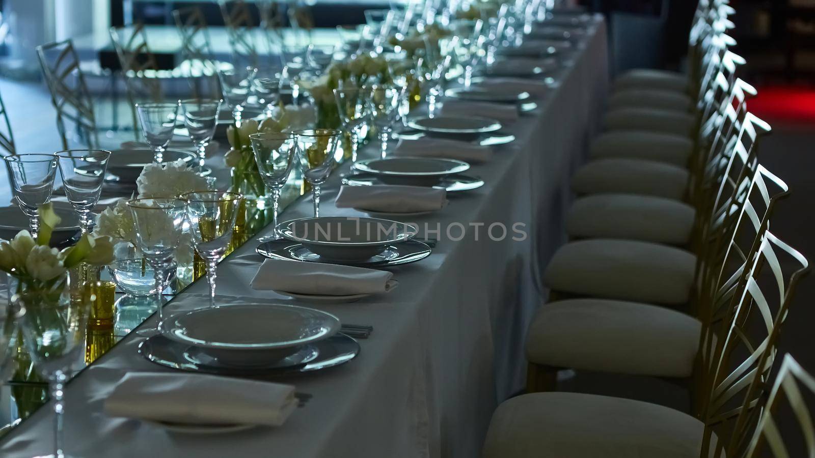 Beautifully organized event. Served festive table ready for guests. Shallow doff