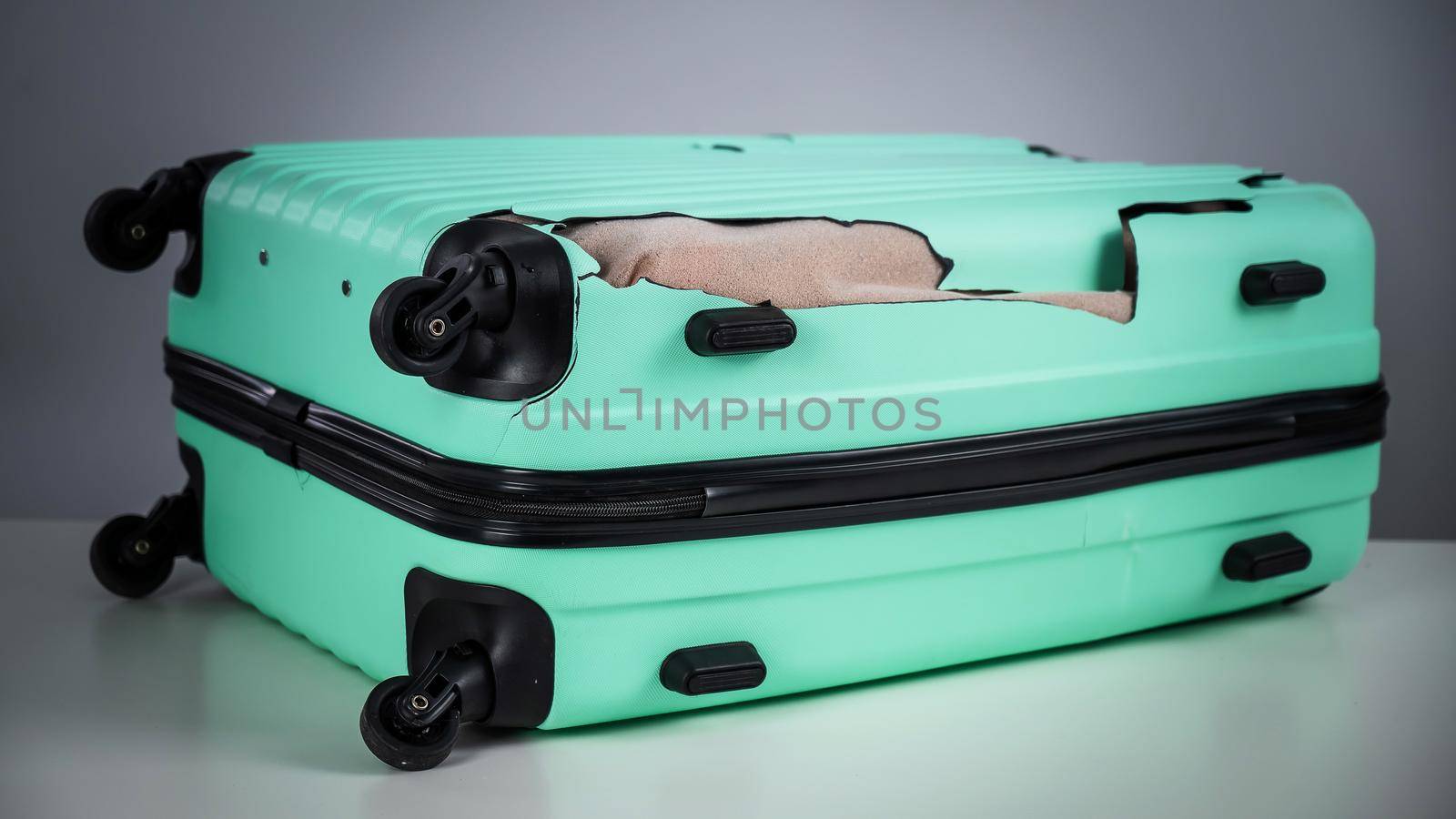 Mint damaged suitcase on a white background. by mrwed54