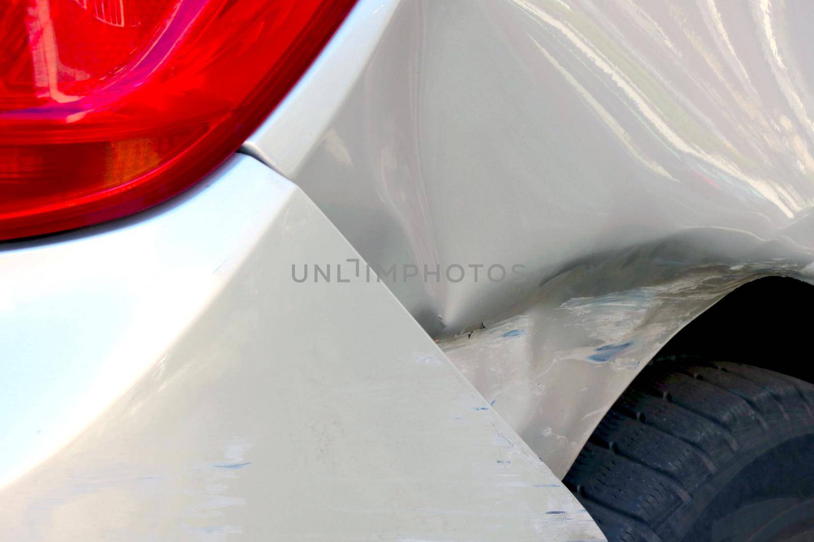 View of broken car fender, road traffic accident. by kip02kas