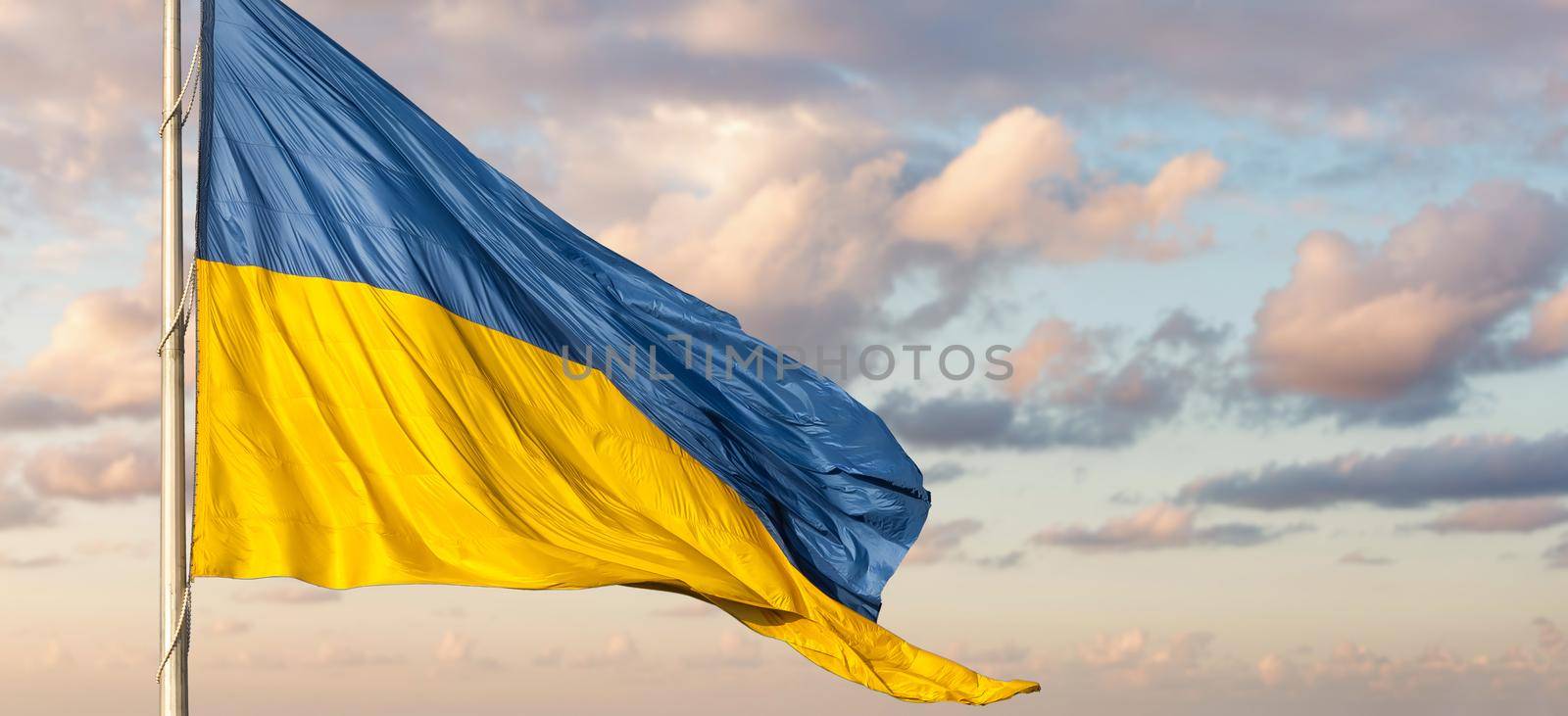 Ukraine flag isolated on the sky with clipping path. close up waving flag of Ukraine. flag symbols of Ukraine by Andelov13