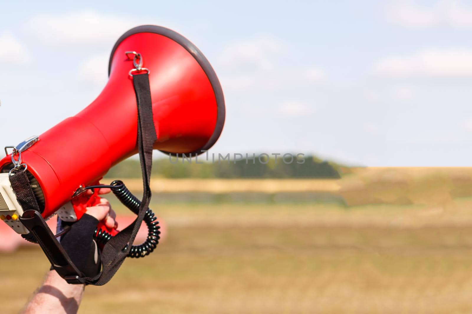 man standing screaming with mouthpiece. by Andelov13