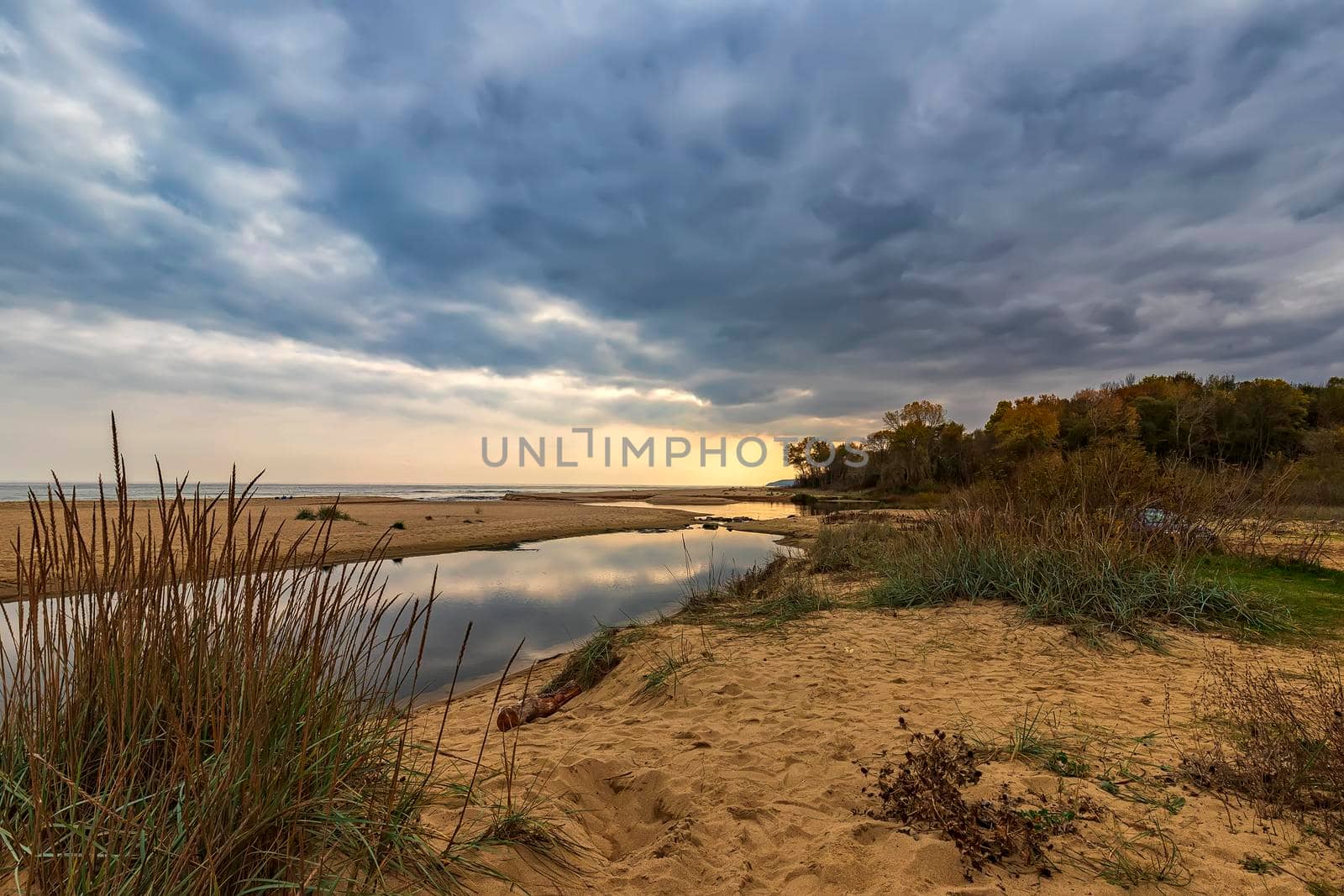 Small lake near sea sand with sky reflection by EdVal