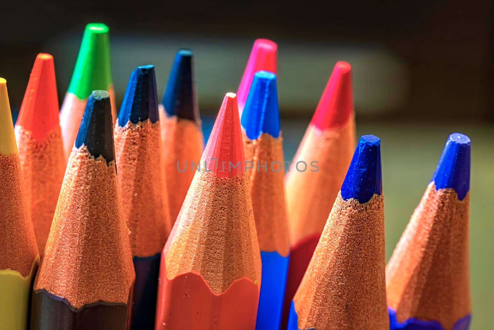 Macro background of the pencil as an element for design. Colored pencils closeup