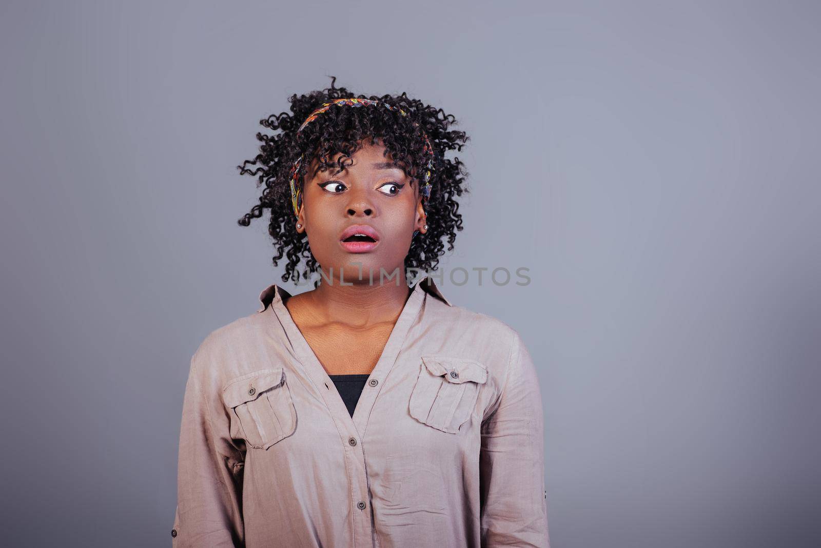 Exams is coming. Attractive afro american woman in casual clothes in the studio.
