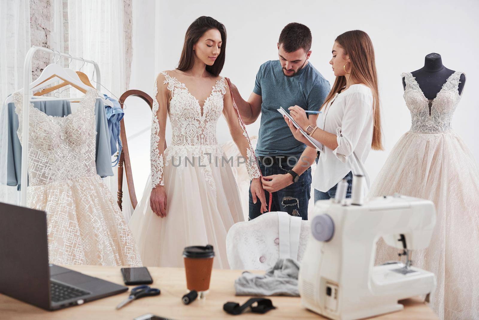 Must be awesome. The process of fitting the dress in the studio of hand crafted clothes.