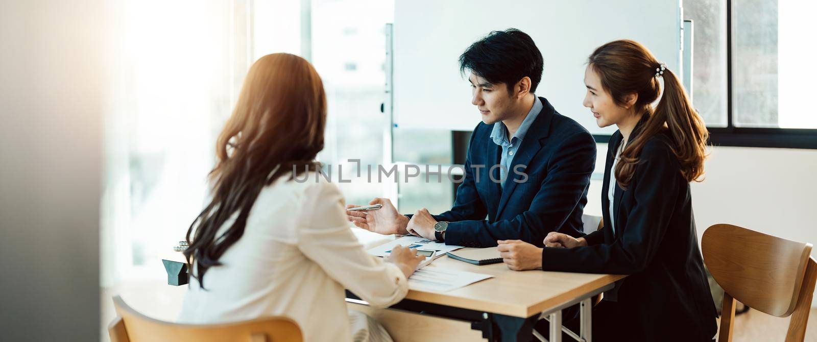 Asian Business People Planning Strategy Analysis from financial document report, Office Concept.