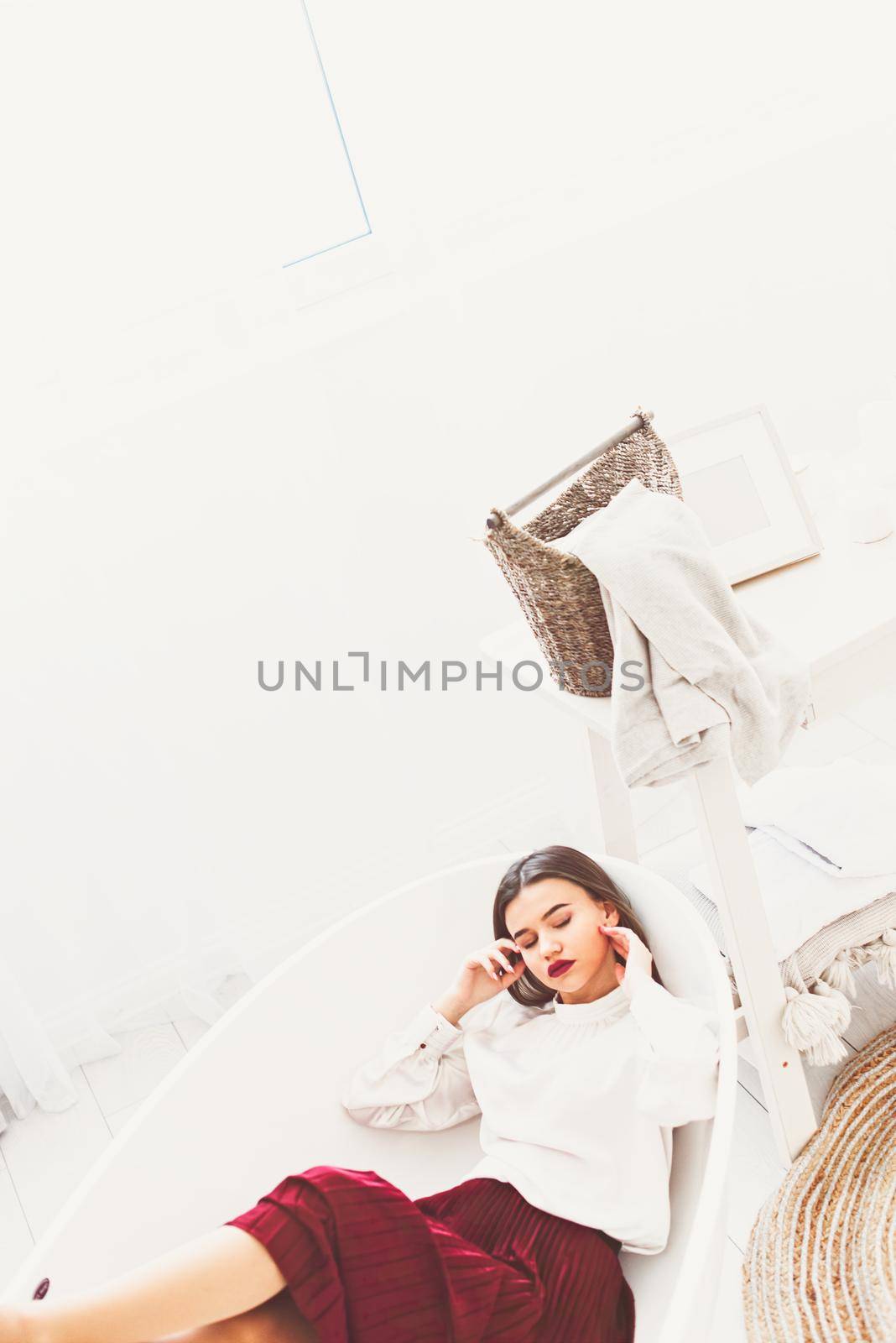 Portrait of fashionable women in red skirt and white blouse posing in a bath by Ashtray25