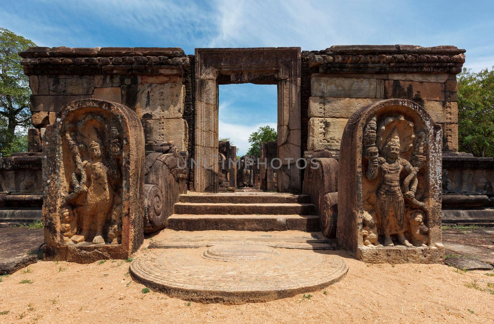 Entrance with stairs with moonstone in ruins in Quadrangle group in ancient city Pollonaruwa - famous tourist destination and archaelogical site, Sri Lanka