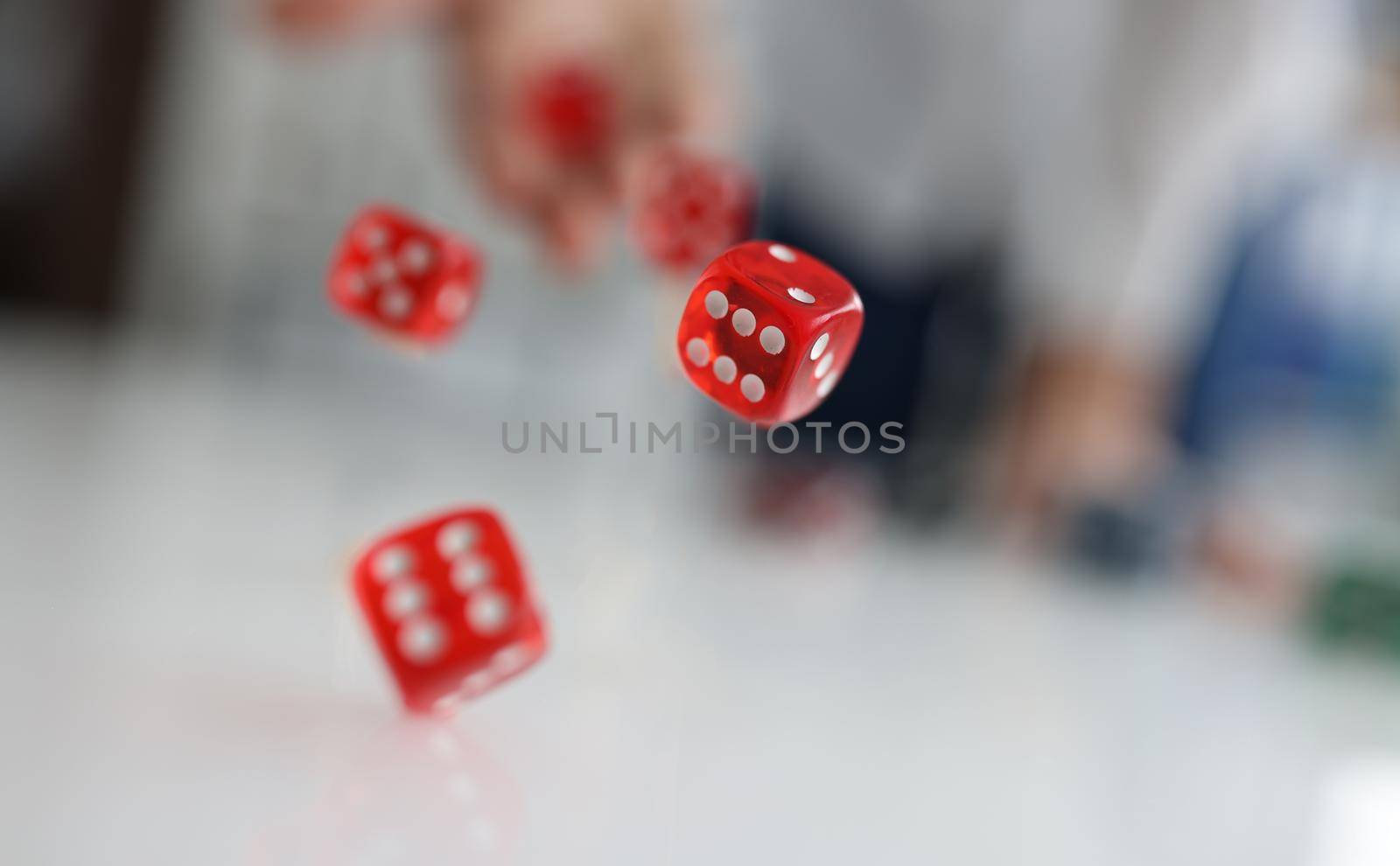 Woman hand throws red dice into air. Good luck gambling bet risk luck win concept