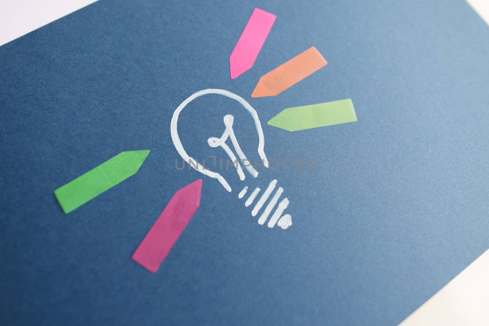 Drawn light bulb and colorful arrow stickers. New ideas and start successful business concept