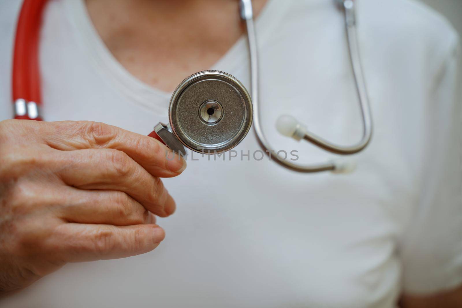 Medical background doctor stethoscope. Happy nurse in hospital uniform, hands with stethoscope isolated on white. Medical care and healthcare concept.