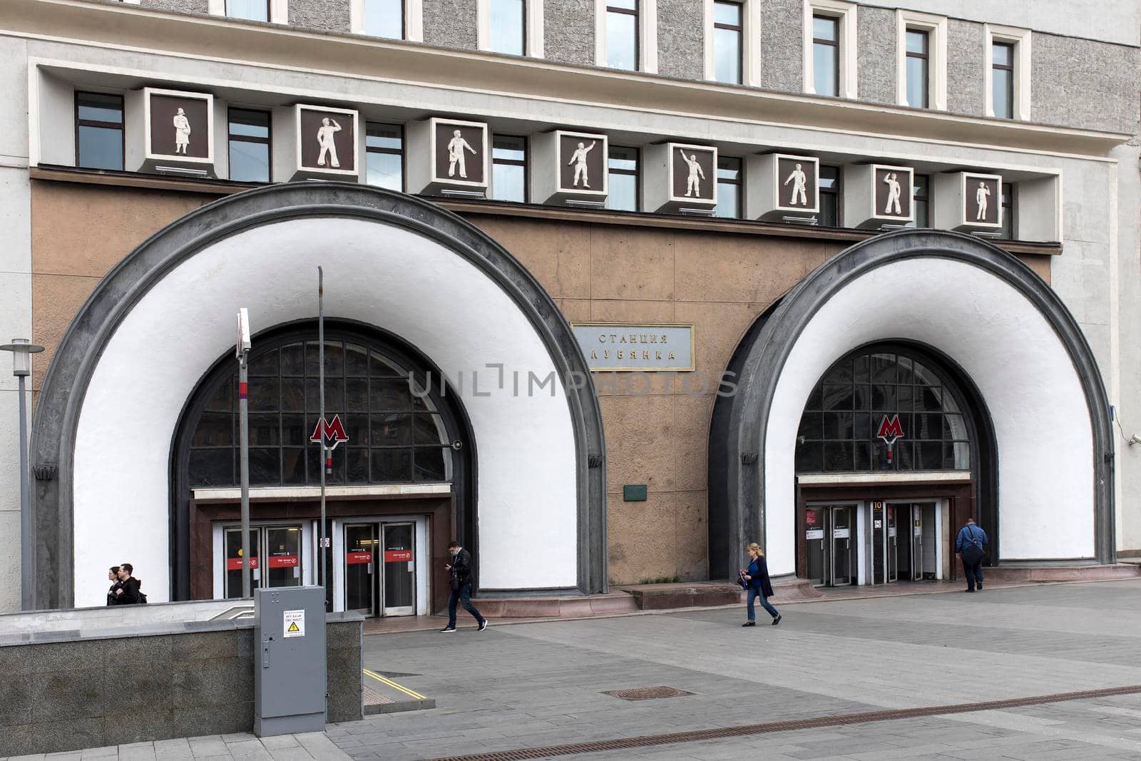 Lubyanka station of Moscow Metro. Entrance designed by architect Iosif Loveyko. Undefined people by elenarostunova