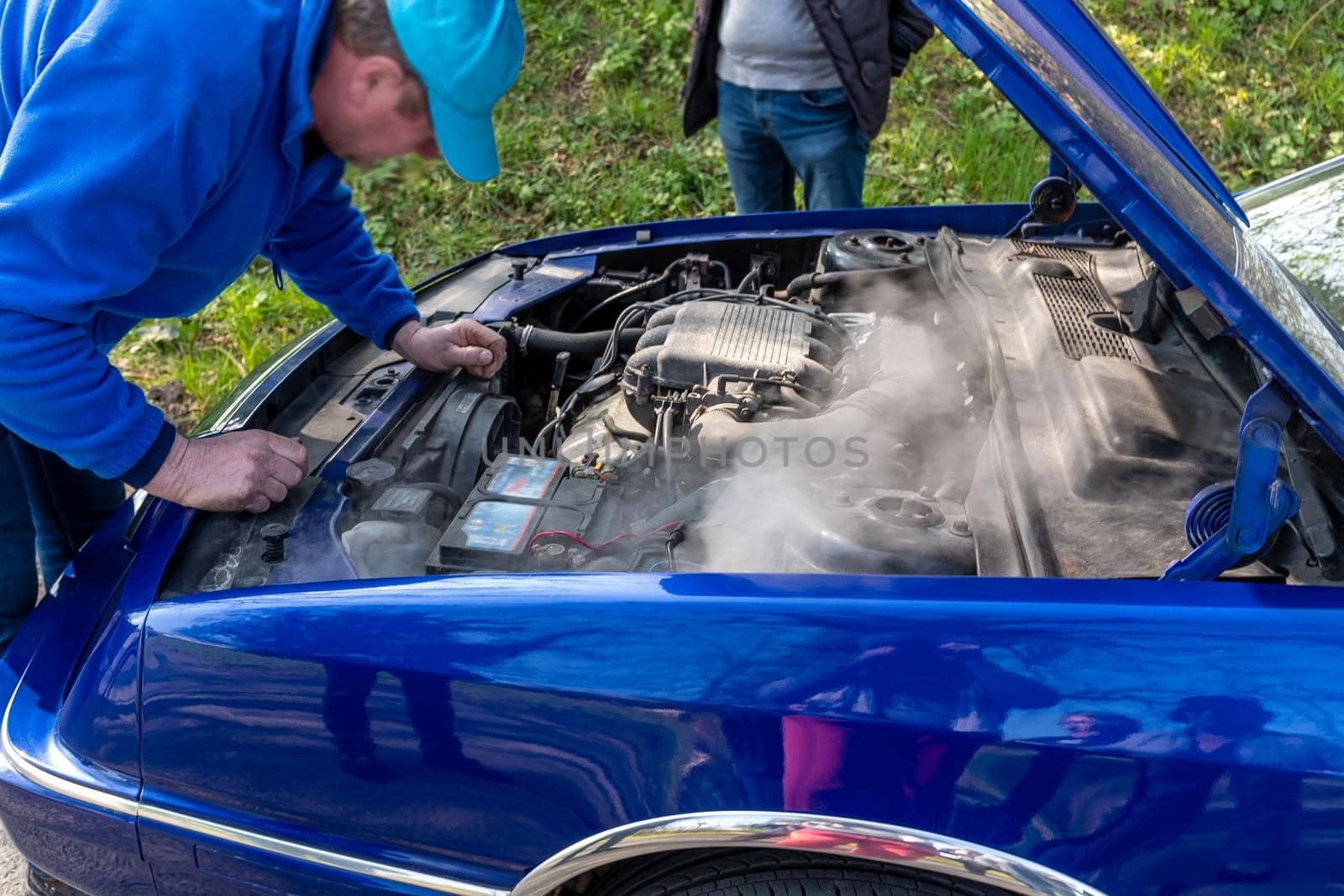 April-03-2022- Vintage car show-France-Bernay-Normandie Overheating of the engine on a car Problems with hoses. by JPC-PROD