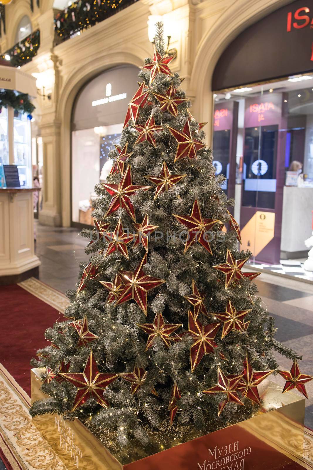 Moscow, Russia - 10 December 2021, Christmas trees decorated in various styles at the GUM department store