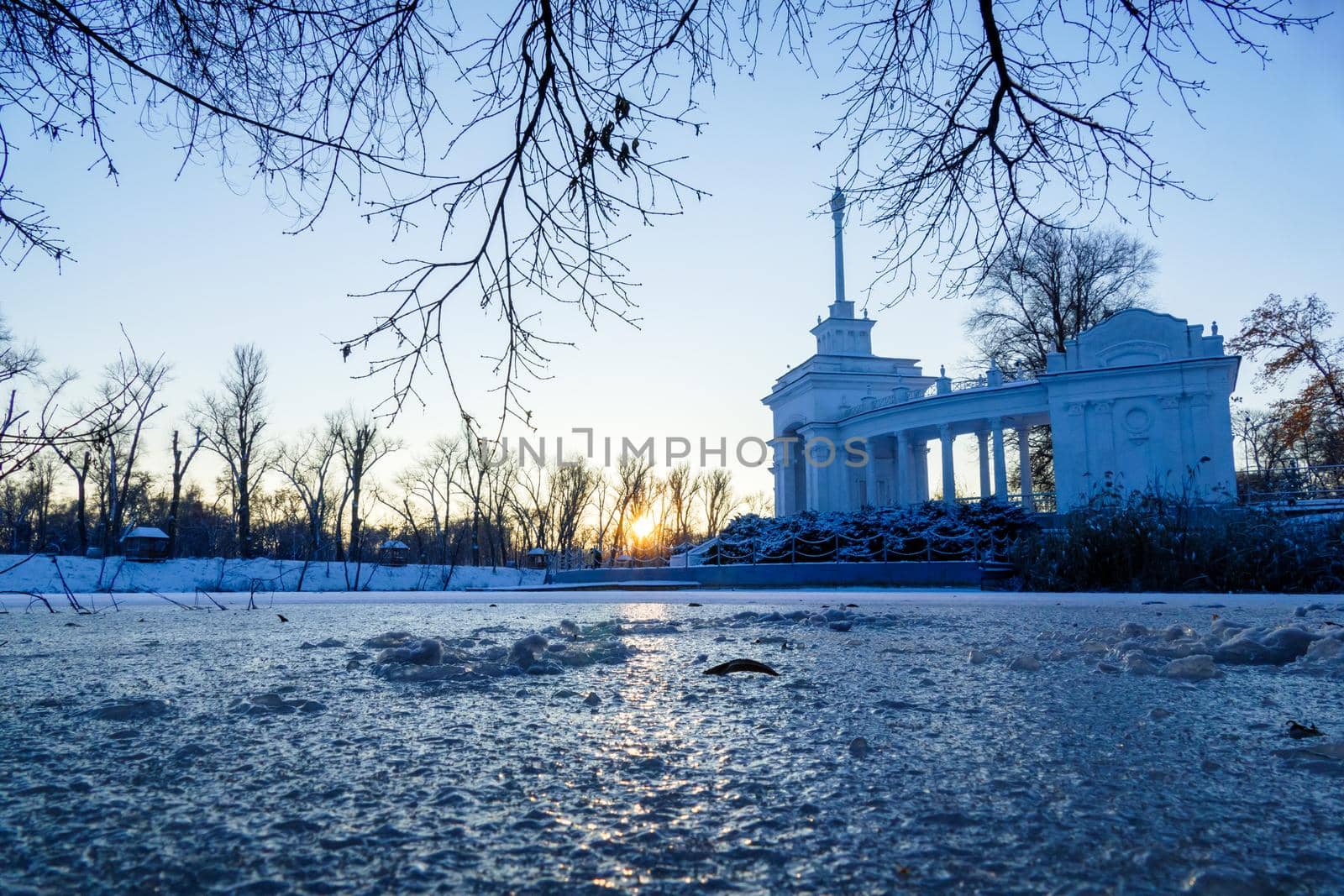 Scenic russian winter wonderland sunset view of non frozen river with trees scenery reflections on water panoramic wide nature background scene by mosfet_ua