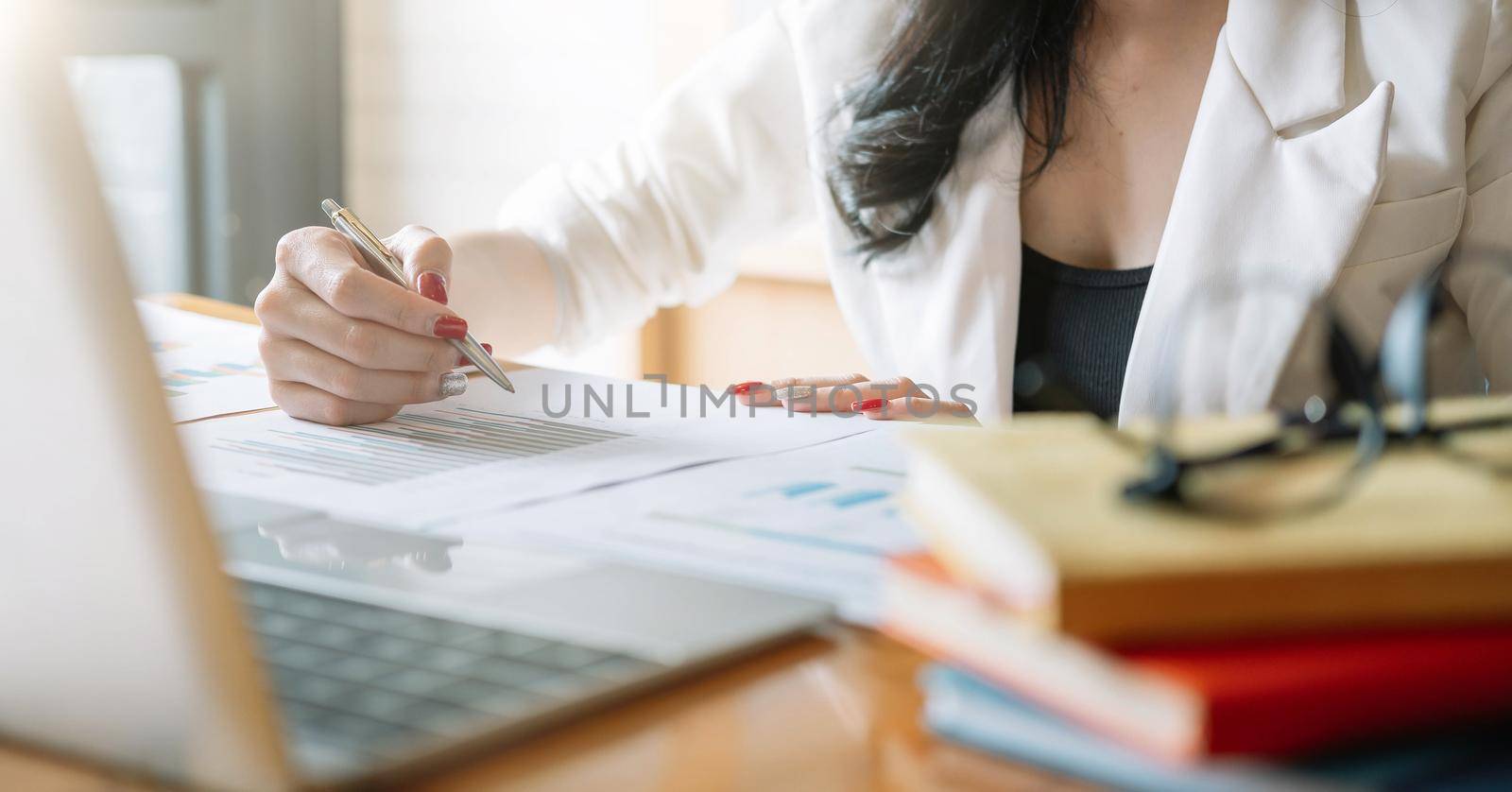 A woman sitting at a table. High quality photo