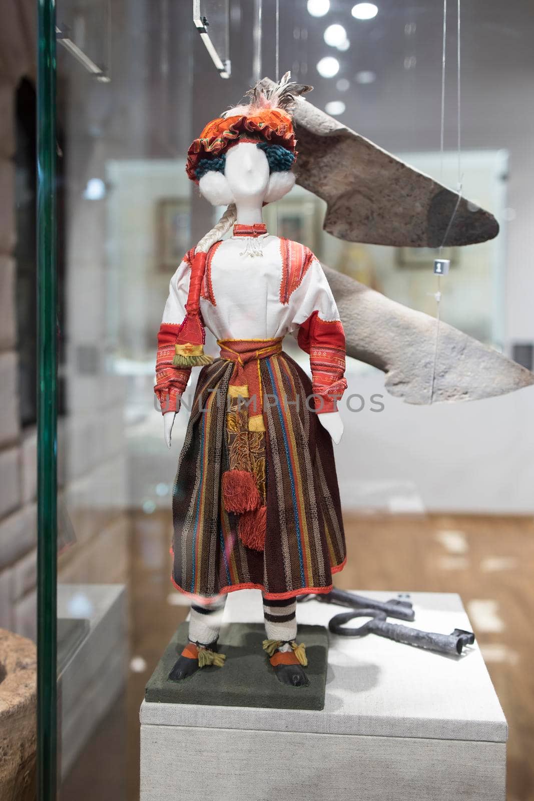 BOGORODITSK, TULA OBLAST, RUSSIA - JUNE 25 2021. The count Bobrinsky palace in Bogoroditsk city. A rag doll dressed in a Russian folk costume. Museum exhibit