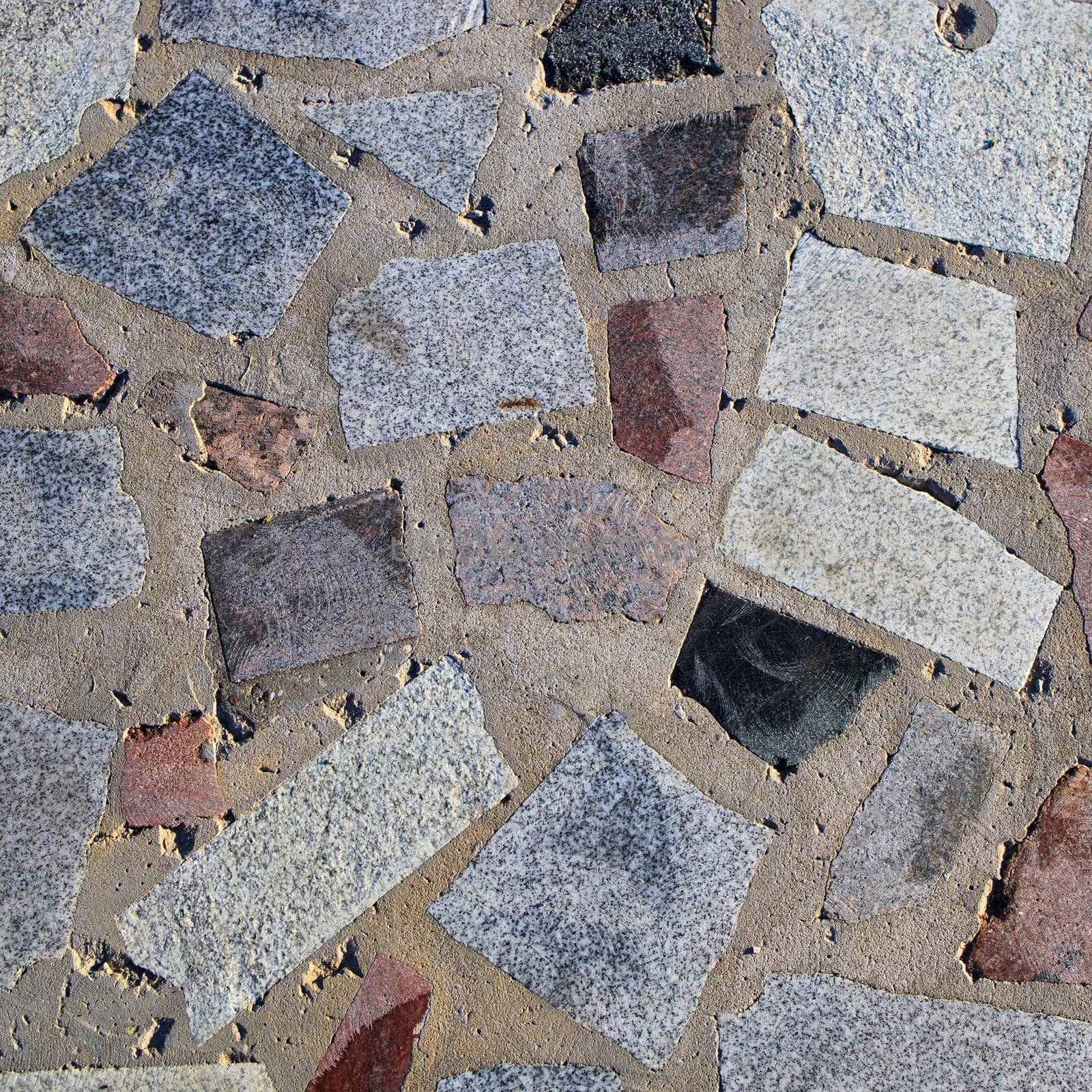 sample of paving stones with decorative unevenly laid stones by elenarostunova