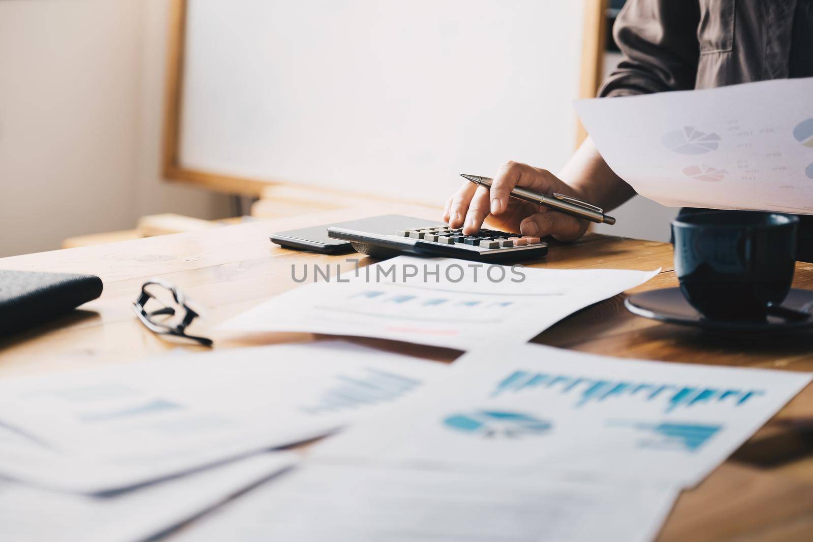 Close up view of bookkeeper or financial inspector hands making report, calculating or checking balance. Home finances, investment, economy, saving money or insurance concept