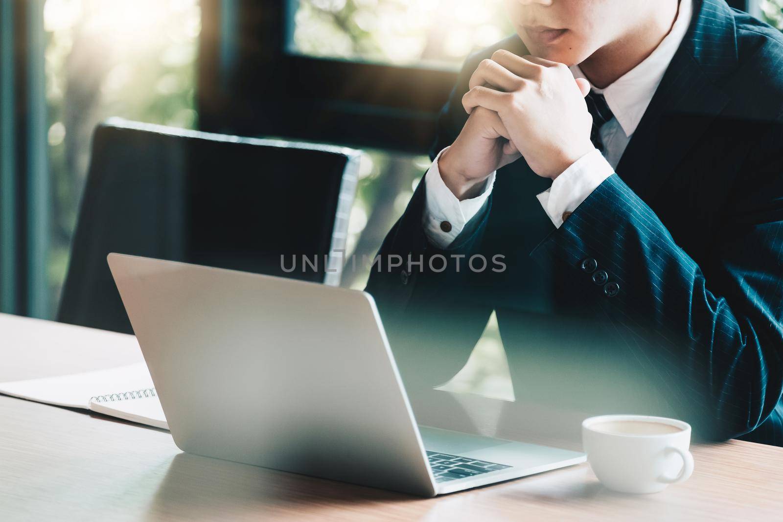 Business man working at office with laptop and documents for financial analysis, consultant lawyer concept by nateemee