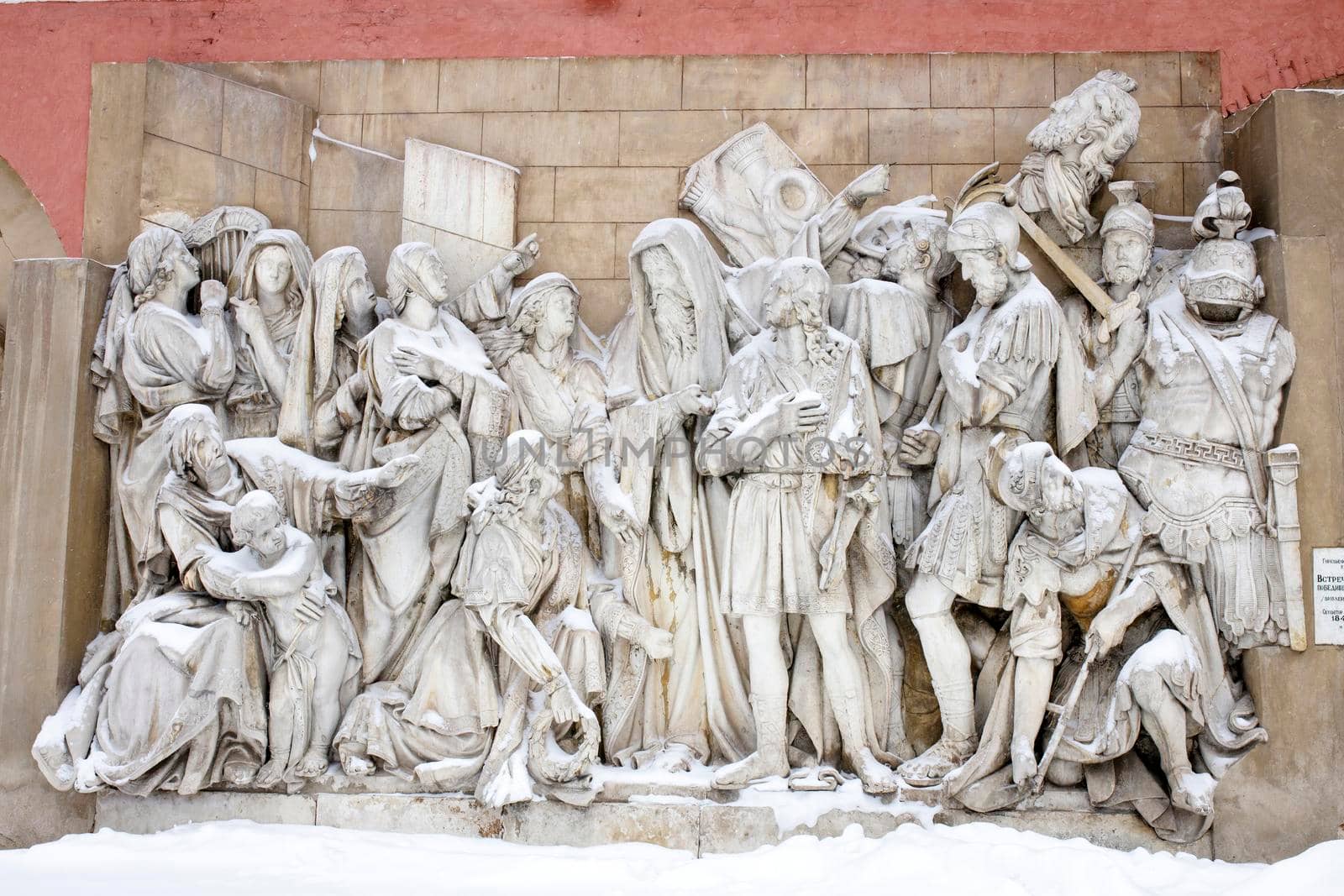 Moscow, Russia - 20 December 2021, bus-relief, David's meeting of defeated Goliath, sculptor A. V. Loganovsky, remains of the ornaments of the old Cathedral of Christ the Savior. Donskoy monastery