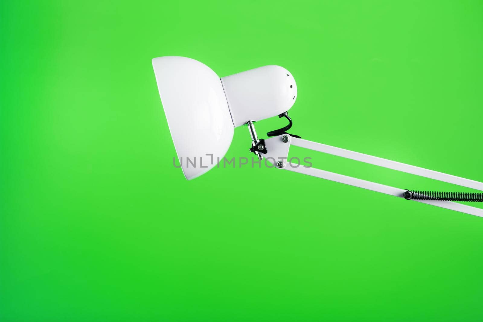 White table office lamp on green background with space for text and idea concept