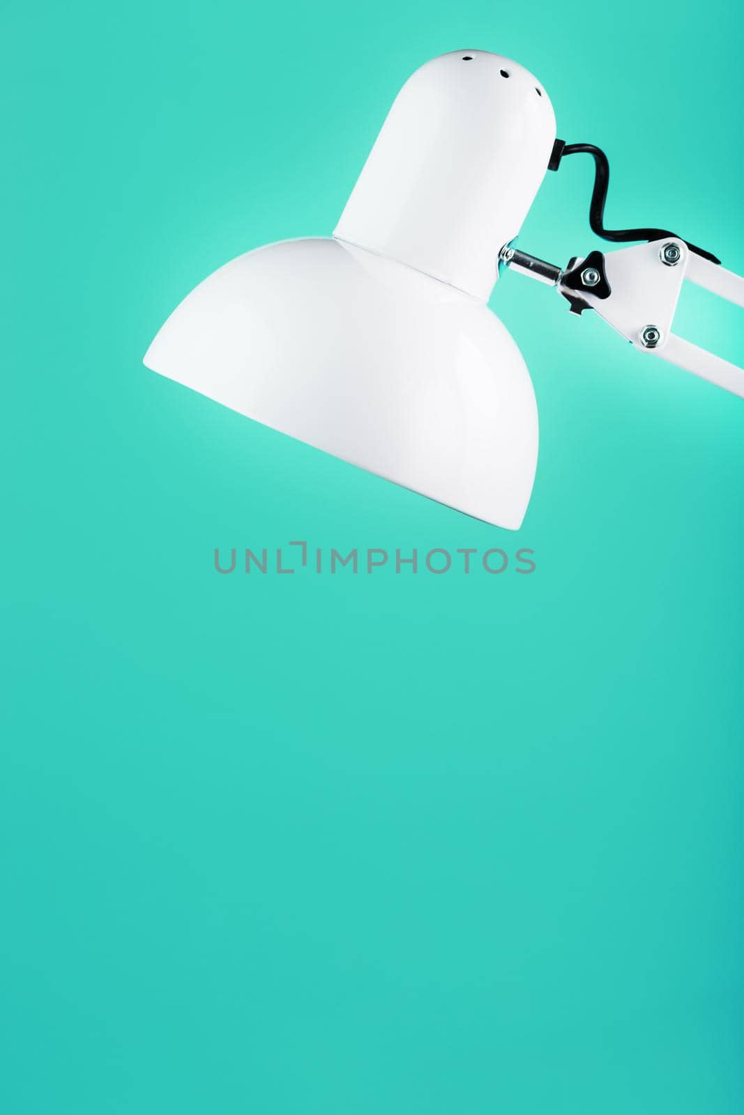 White table office lamp on green background with space for text and idea concept