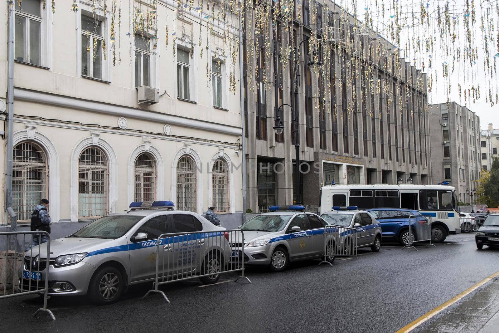 Police cars and paddy wagons near the building of the Federation Council by elenarostunova