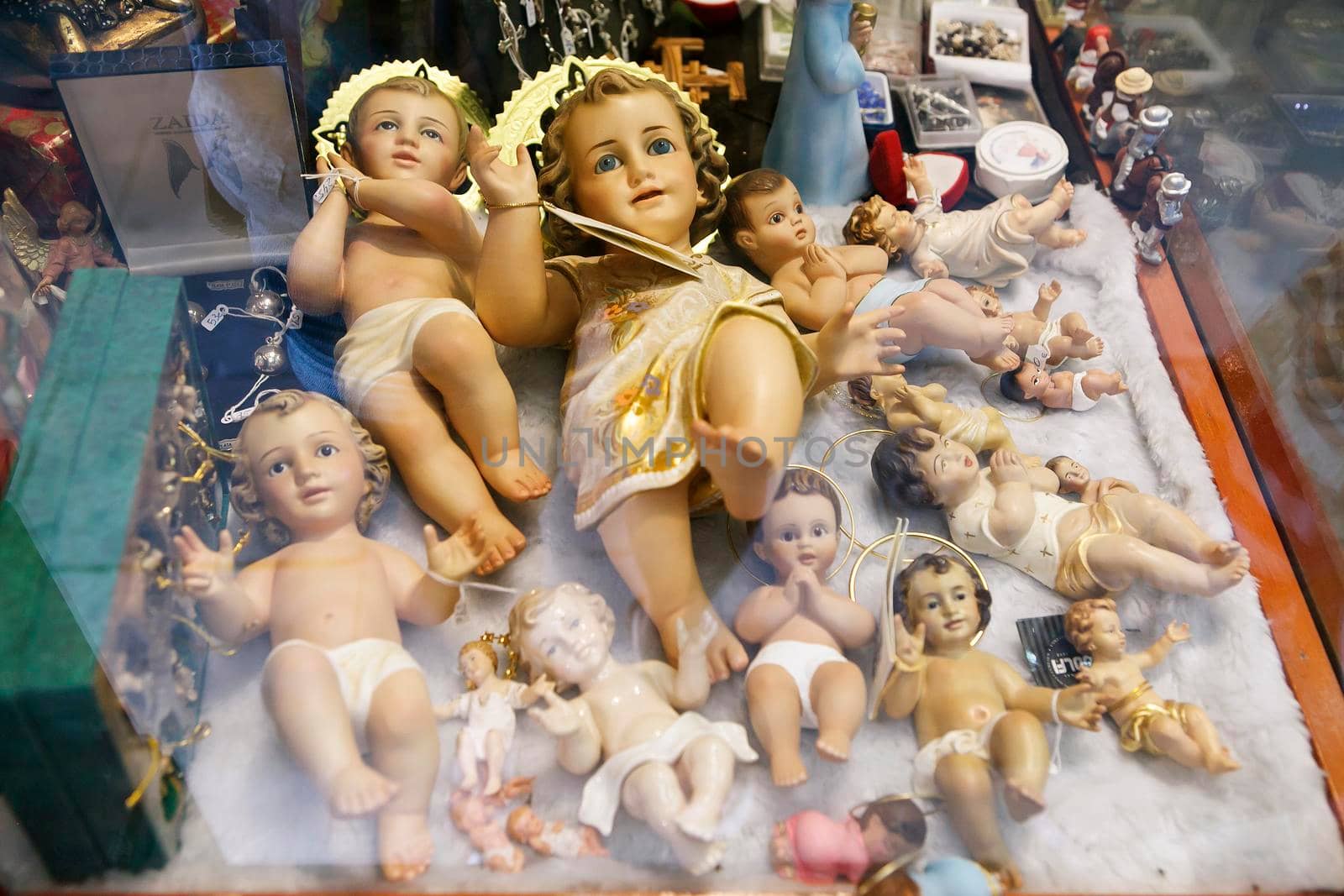 Barcelona, Spain - 20 July 2018, Porcelain, wooden, ceramic, plastic angels in an antique shop window