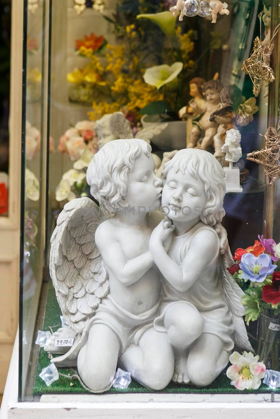 Barcelona, Spain - 20 July 2018, Marble angels in an antique shop window
