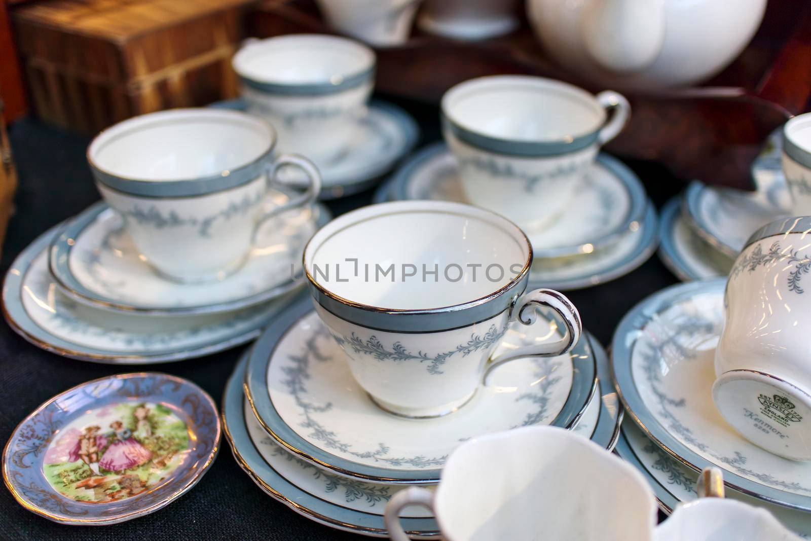 London, UK - 20 July 2020, A century old blue tea set with roses at the Spitalfields Flea Market