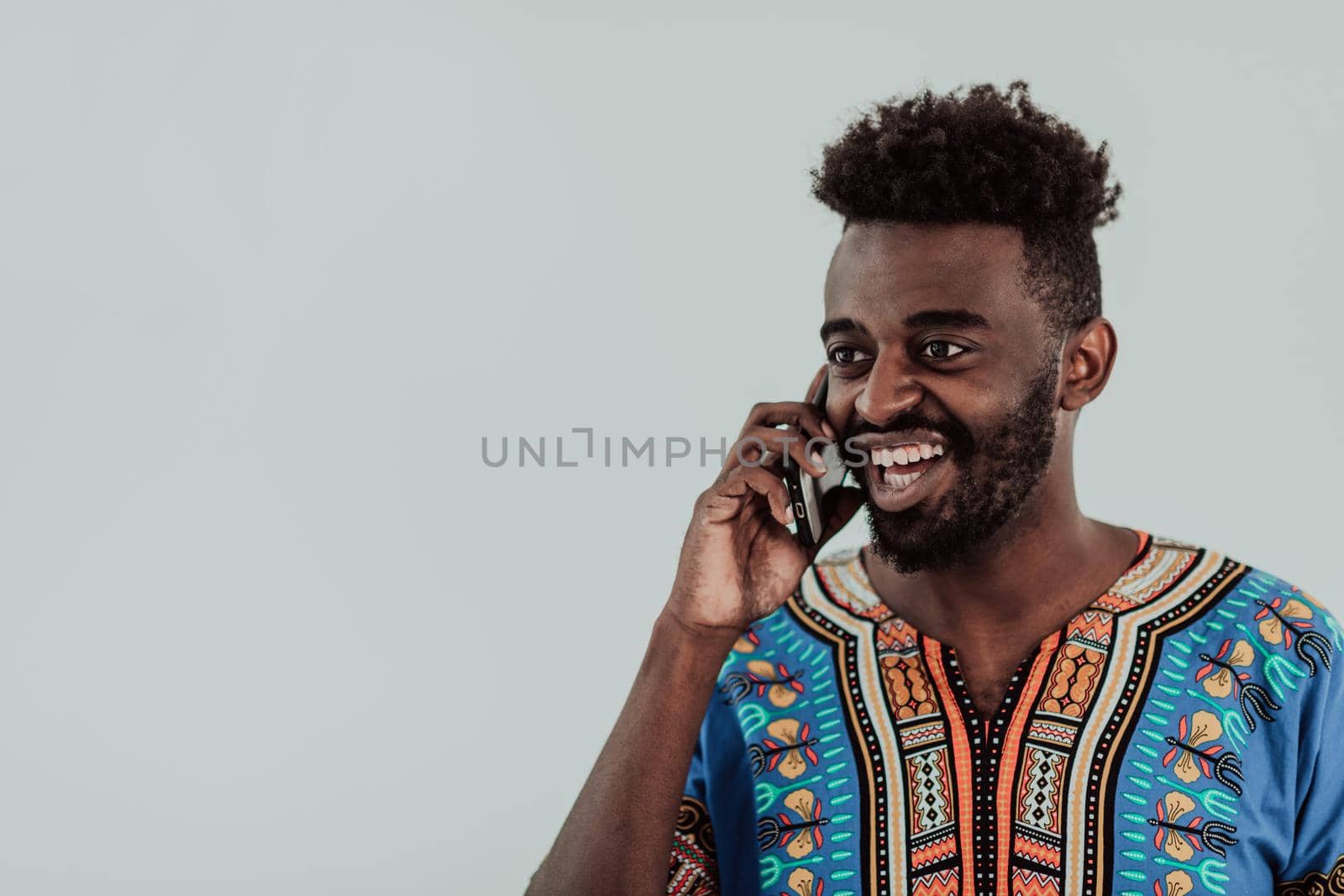 Native Sudan African male using smartphone isolated on white background. High-quality photo