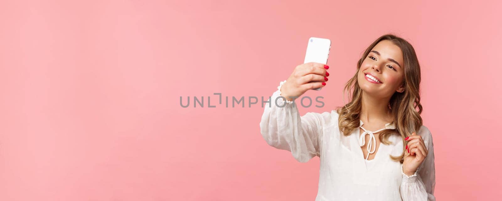 Close-up portrait of beautiful and stylish blond girl taking selfie in park at spring, gather likes and followers, make blogger content, taking photo on smartphone, smiling sassy, pink background by Benzoix