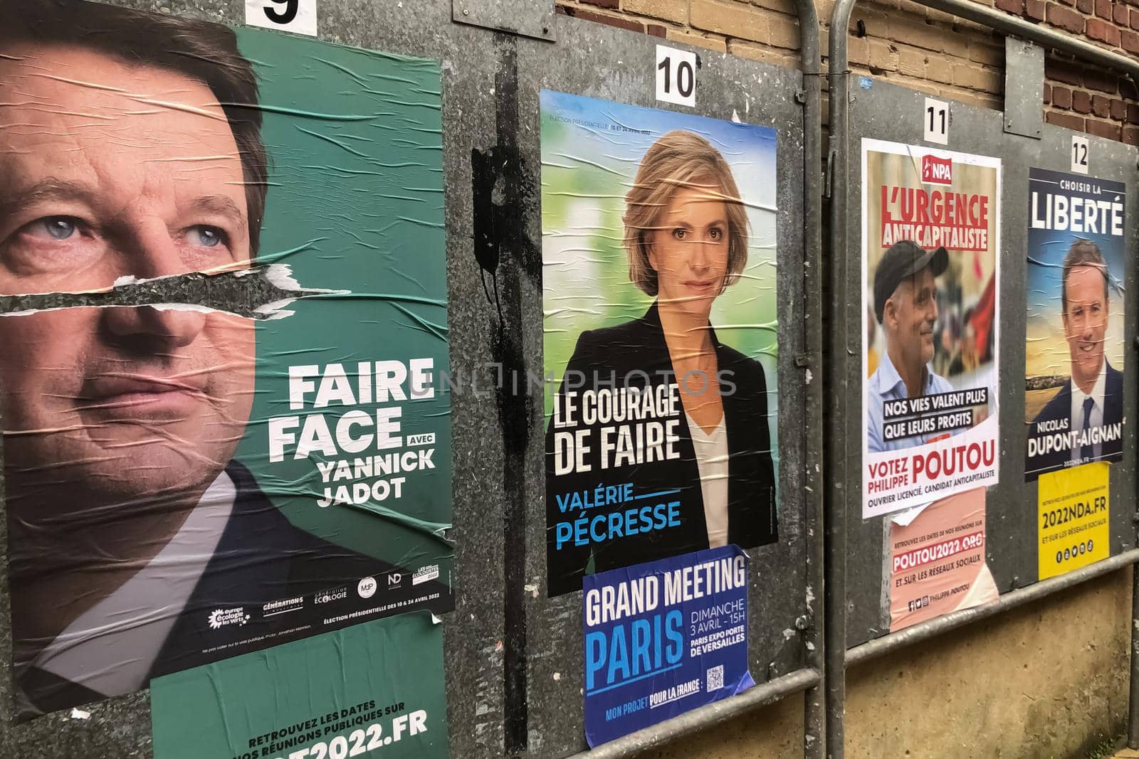 PARIS, FRANCE - APRIL 06, 2022 : The banners with candidates for President elections