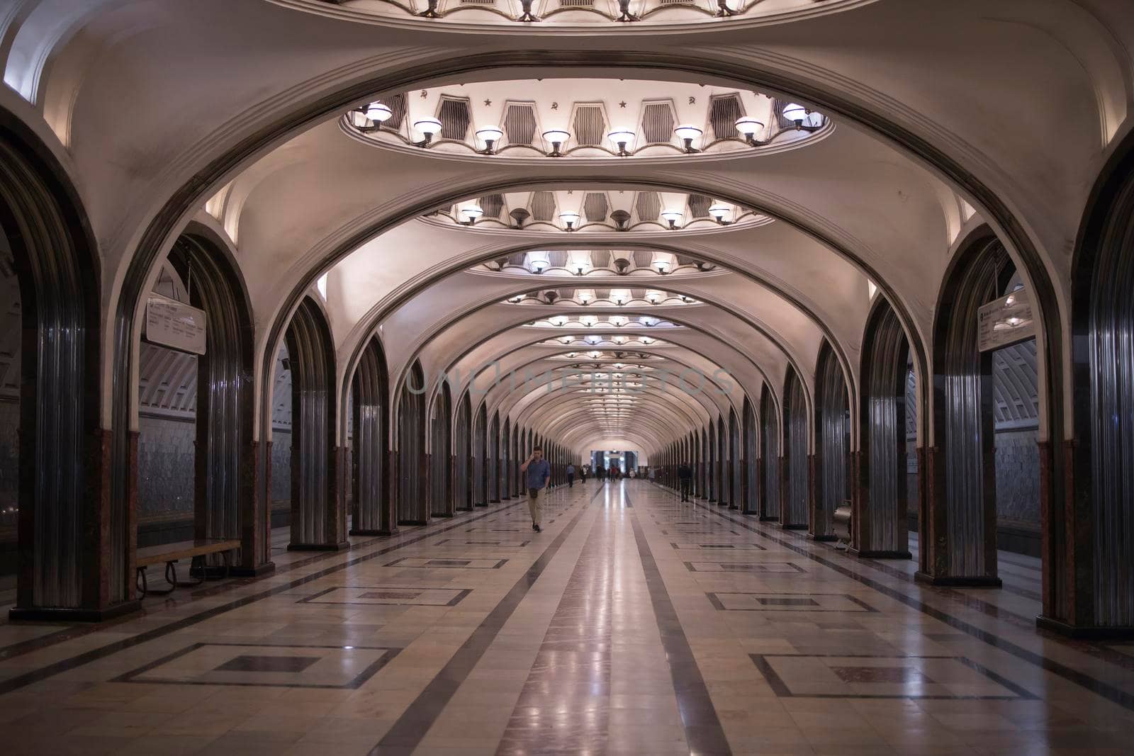 The lobby of the Mayakovskaya station with arches and mosaic ceilings. Stalinist Empire by elenarostunova